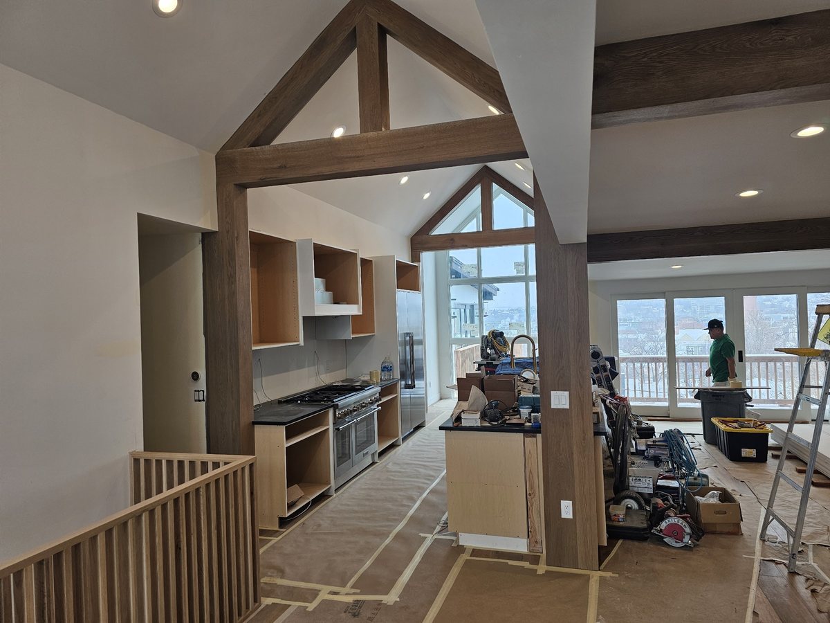 Finished great room with timber trusses at 1450 High St