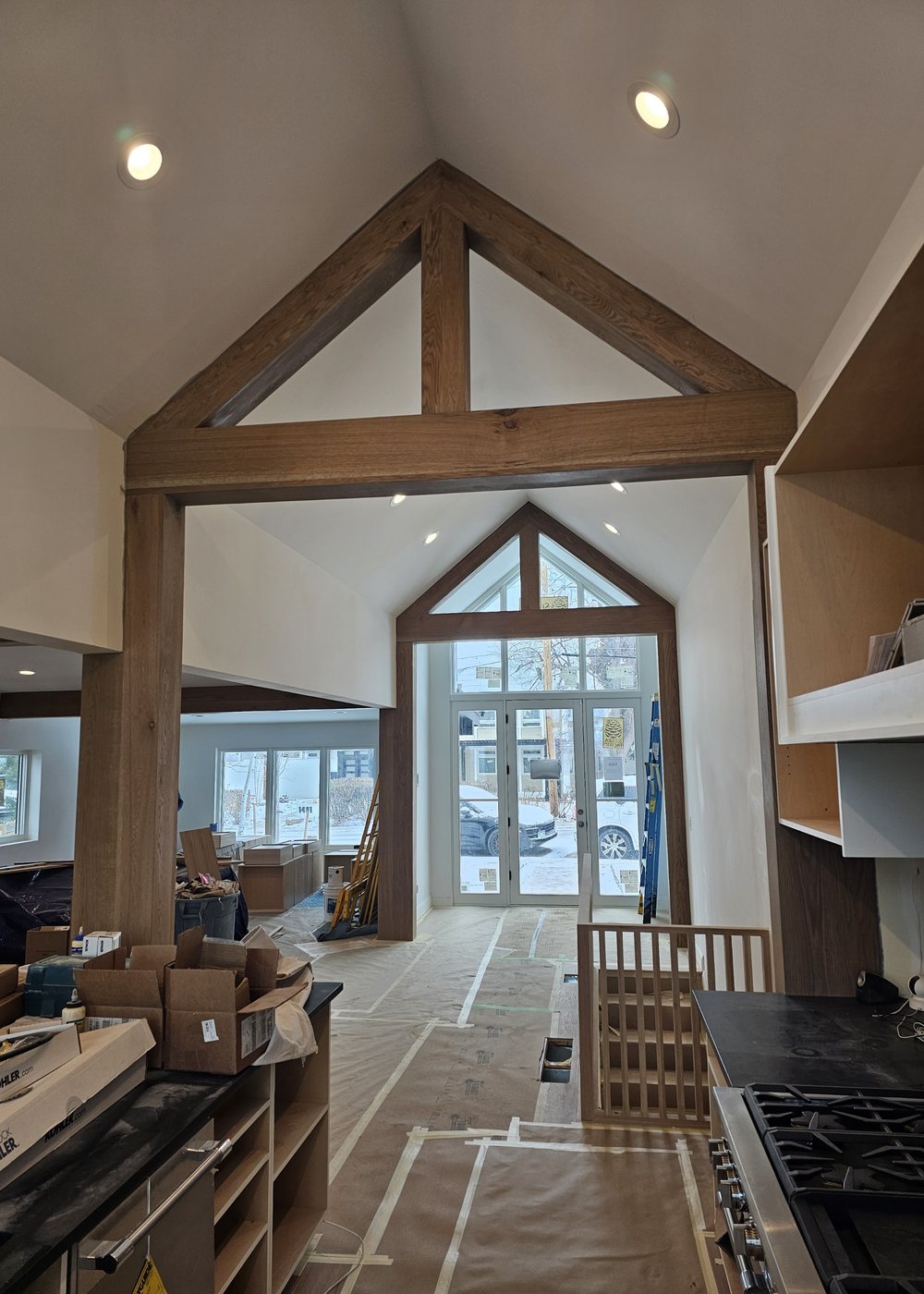 Great room timber truss and vaulted ceiling