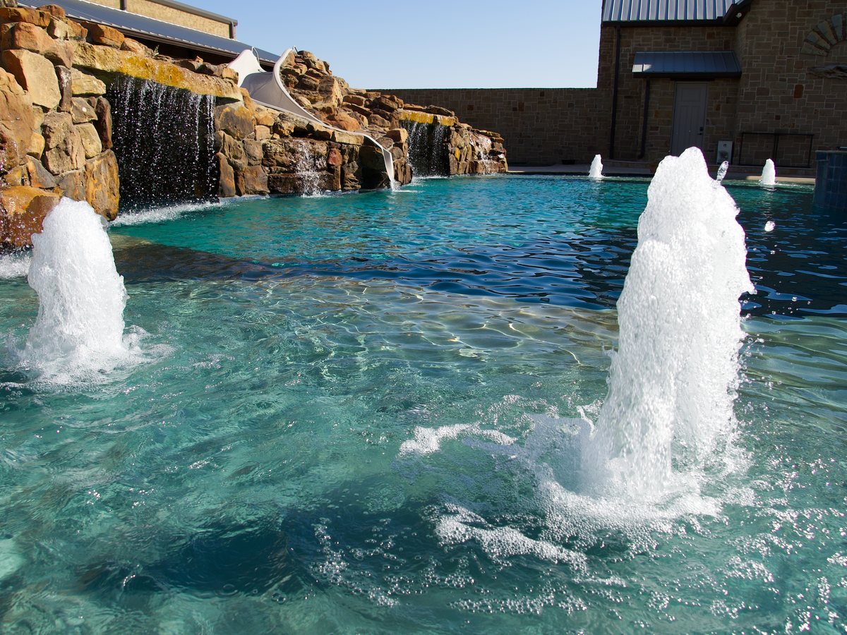 Resort pool with rock waterfall and bubblers