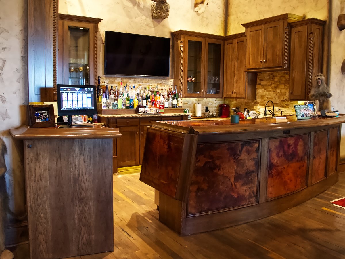 Custom trophy bar with figured wood front
